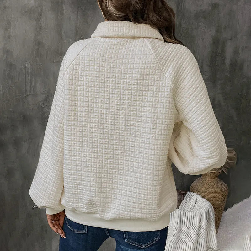 Women's beige polo collar pullover sweater with long sleeves, laid flat.