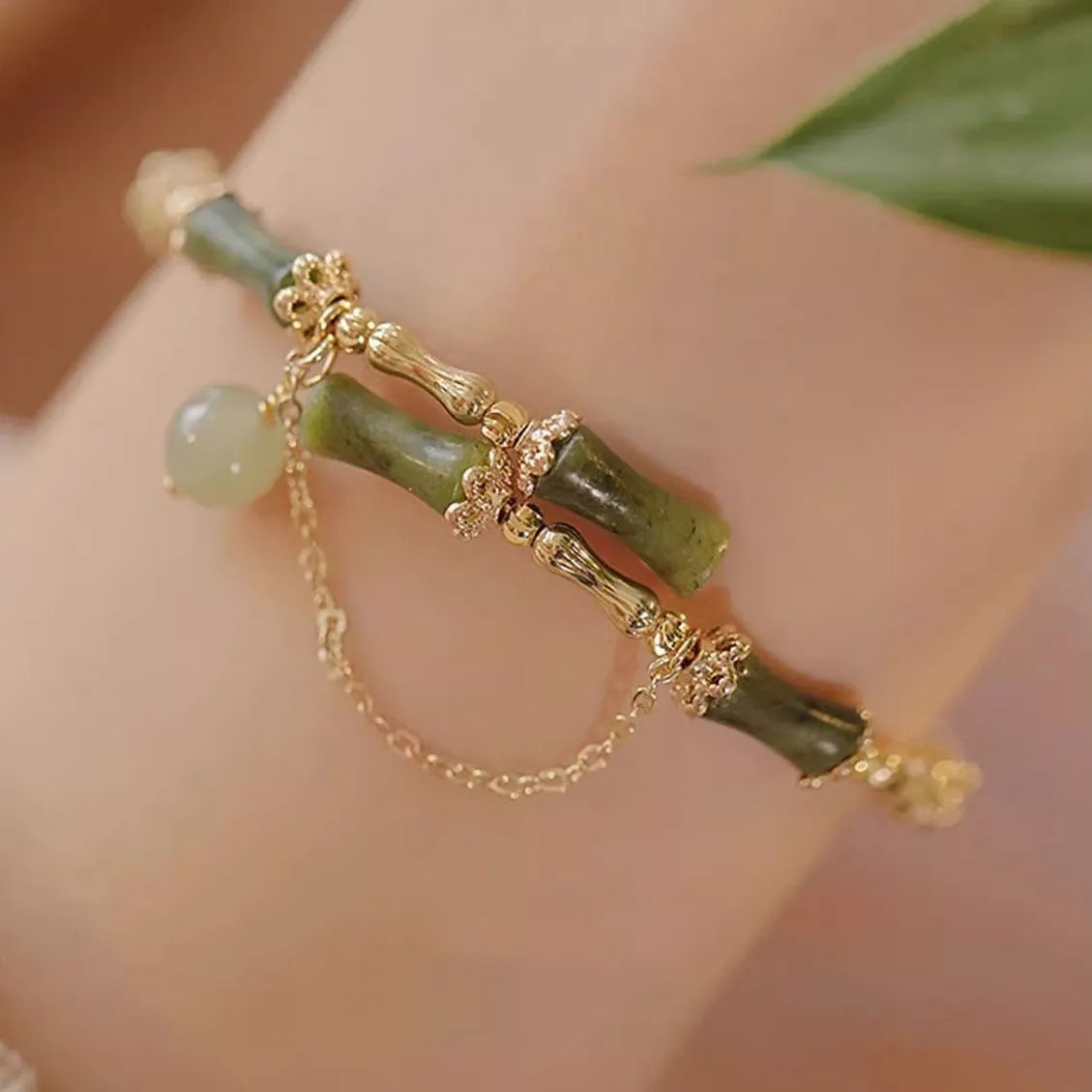 Personalised plum wine coloured glaze bracelet with a central bamboo joint bead for women.