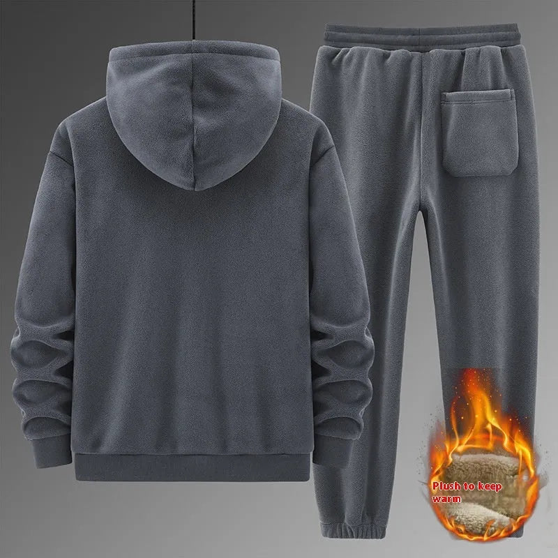 Grey men's hooded sweater and matching trousers casual sports suit set on a hanger.
