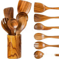 Seven-piece wooden spoon and spatula kitchen utensil set on kitchen counter