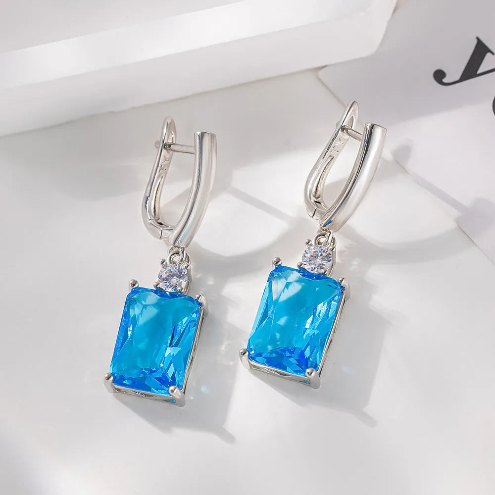 Square geometric copper earrings with electroplated gold finish showing quadrilateral shape design