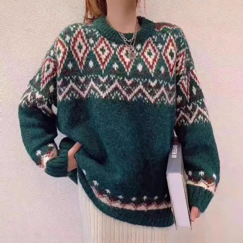 Red and white striped loose retro pullover knitted top with long sleeves on a hanger.