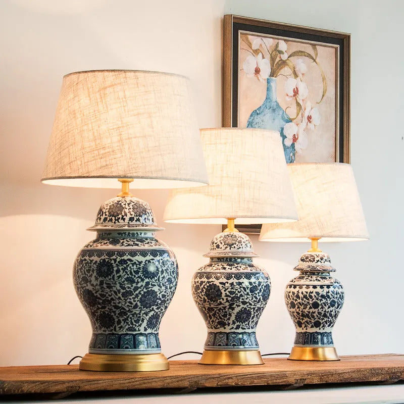 Blue and white porcelain Chinese style table lamp with ceramic base and cloth shade.