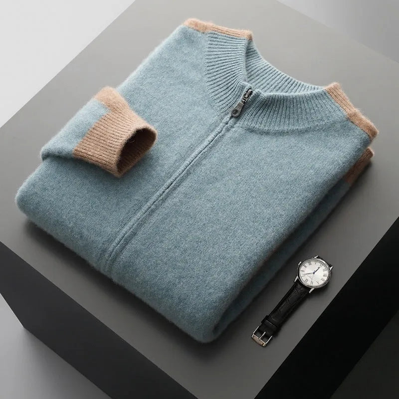 Man wearing a dark blue thick wool zip-front cardigan with a half turtleneck collar.