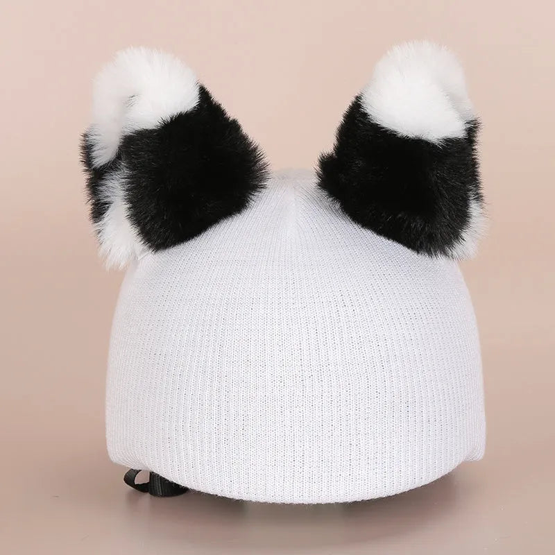 Soft plush cartoon character cover on a ski helmet for decoration.