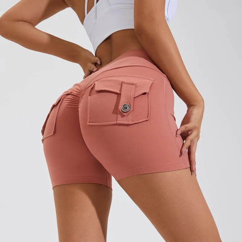 Women's high-waist fitness shorts in quick-dry nylon with side pockets, shown in Electric Blue.