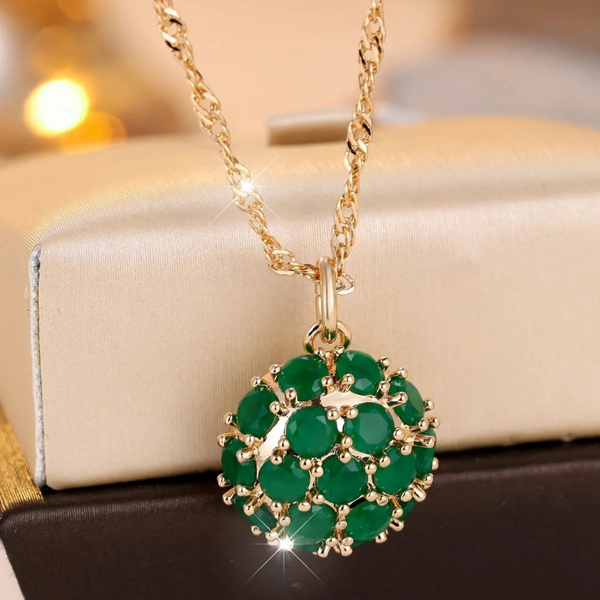 Round geometric emerald diamond necklace with champagne gold finish and adjustable chain