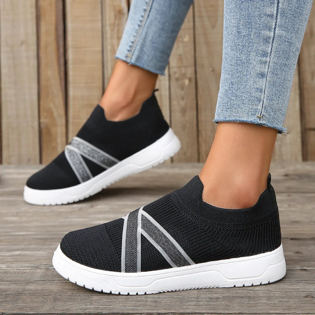 Black women's flyknit mesh casual shoes with flat rubber sole and tassel detail