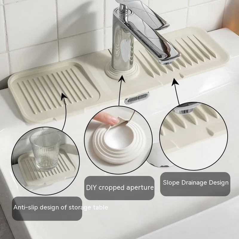 Silicone faucet splash guard pad in beige colour with sloped design and two drain channels.