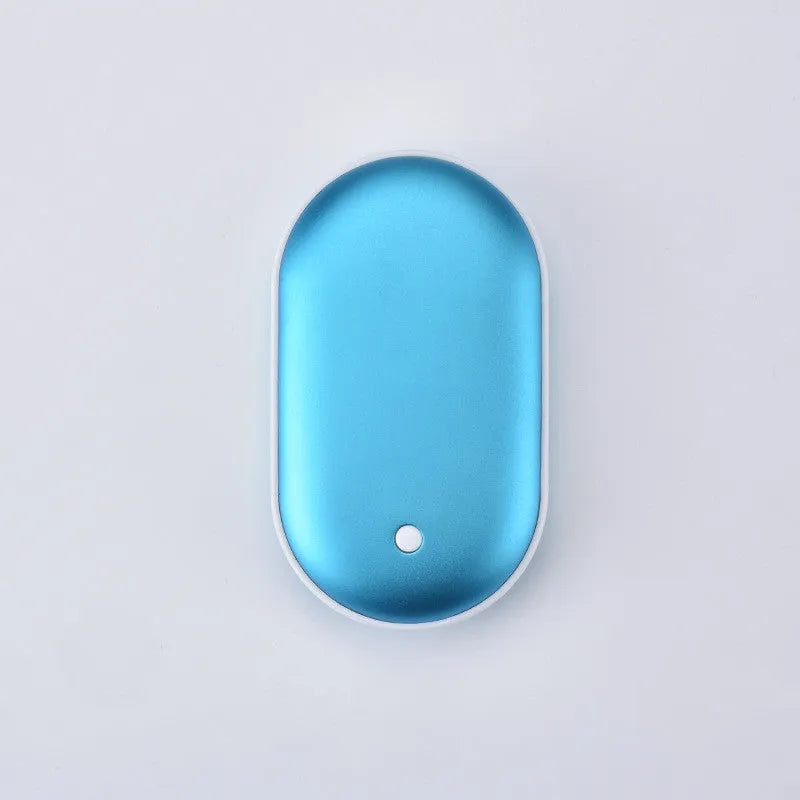 Rose gold rechargeable mini hand warmer and USB power bank two-in-one unit on a table.