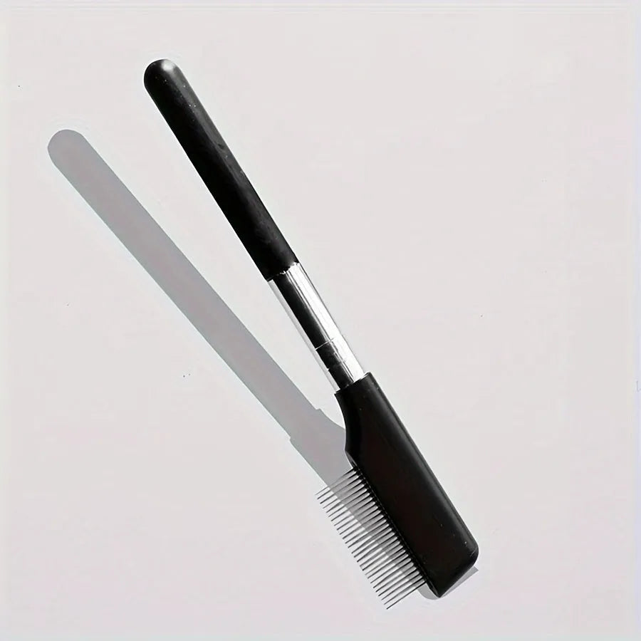 Black dual-head pet grooming brush with soft silicone bristles and a comb for eye cleaning and hair removal.