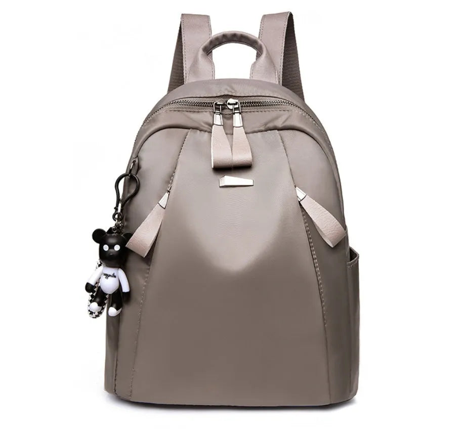Medium Oxford cloth rucksack in wine red colour showing internal compartments and shoulder straps