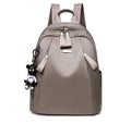 Medium Oxford cloth rucksack in wine red colour showing internal compartments and shoulder straps