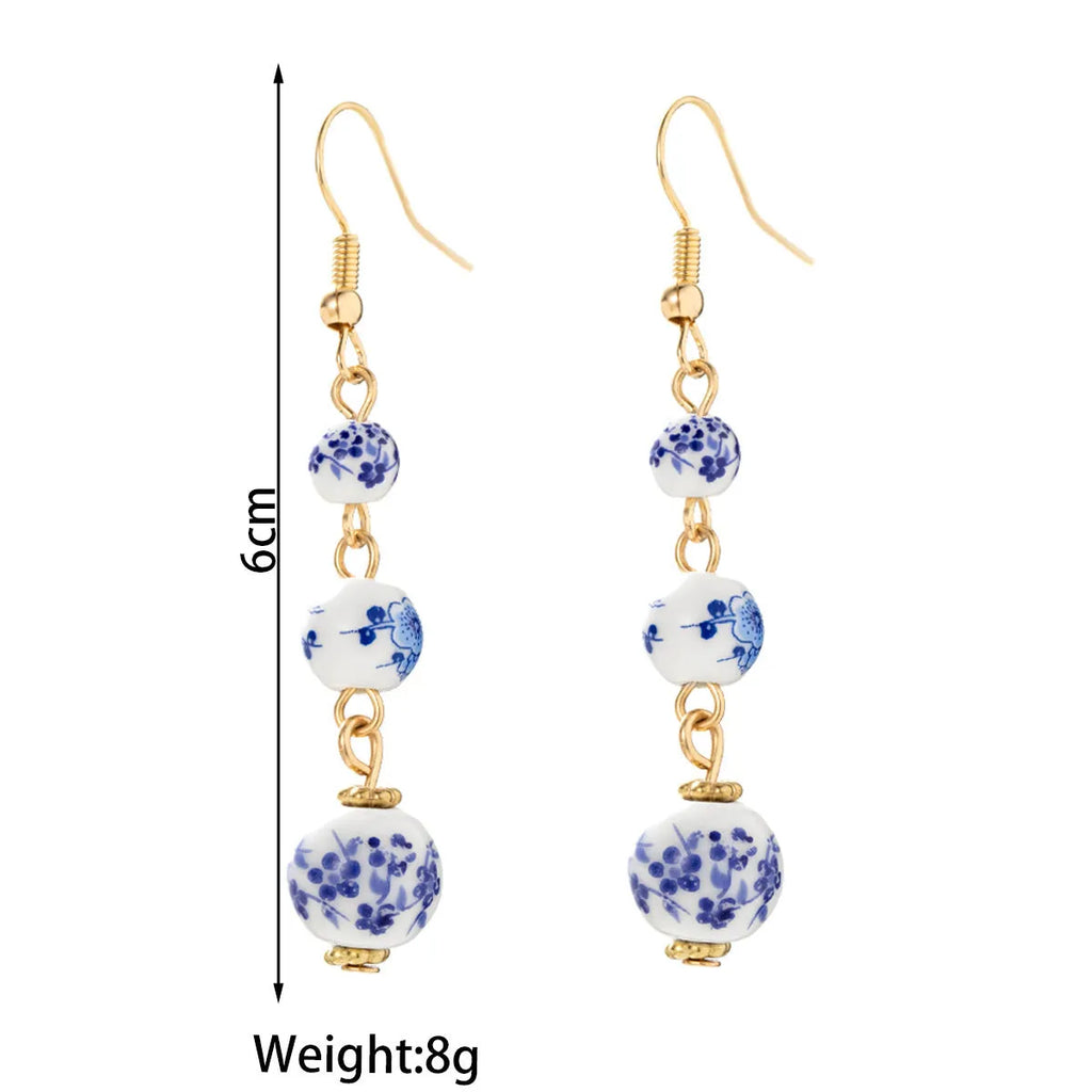 Blue and white porcelain ceramic bead retro earrings with geometric alloy electroplated construction