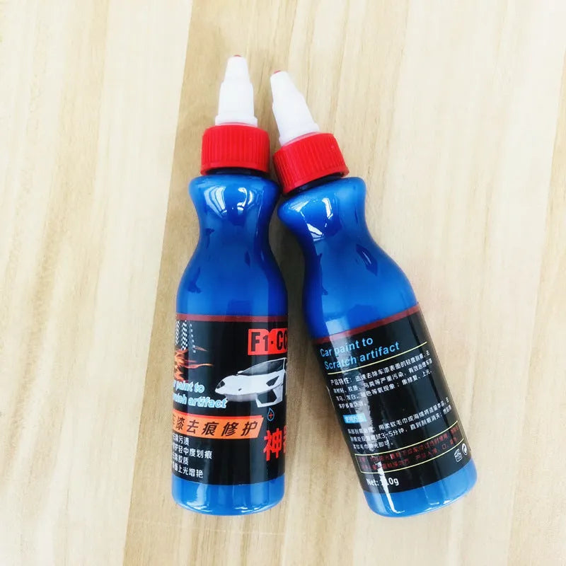 Small blue car scratch repair applicator tool with wiping sponge and repair agent bottle