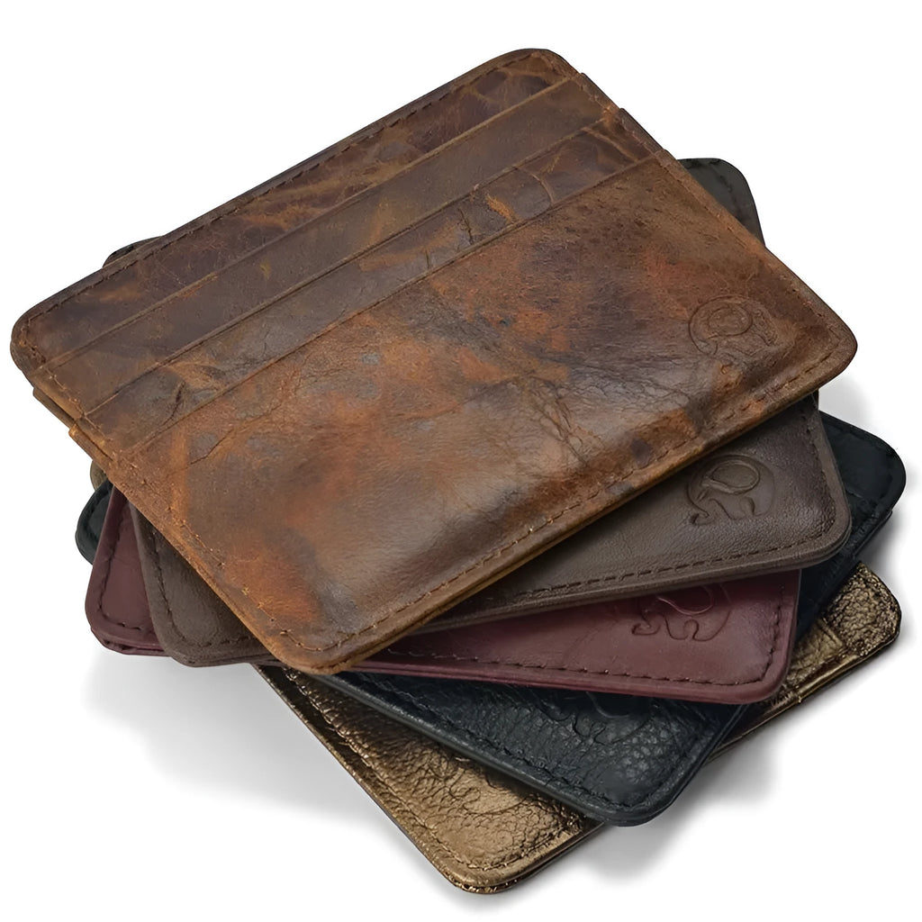 Genuine leather magic wallet in black with elastic band closure, slim card holder for cards and notes.
