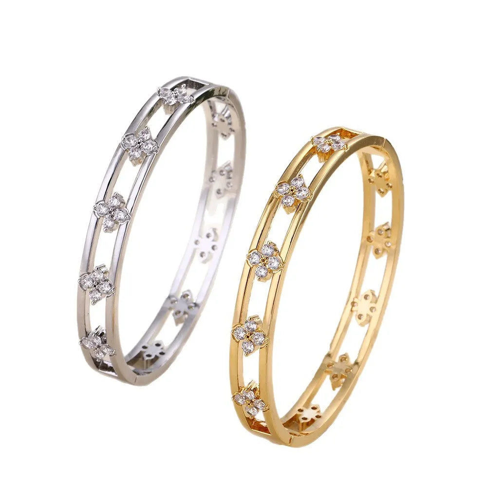 Women's hollow bracelet with four-leaf clover design and zircon stones in gold or silver