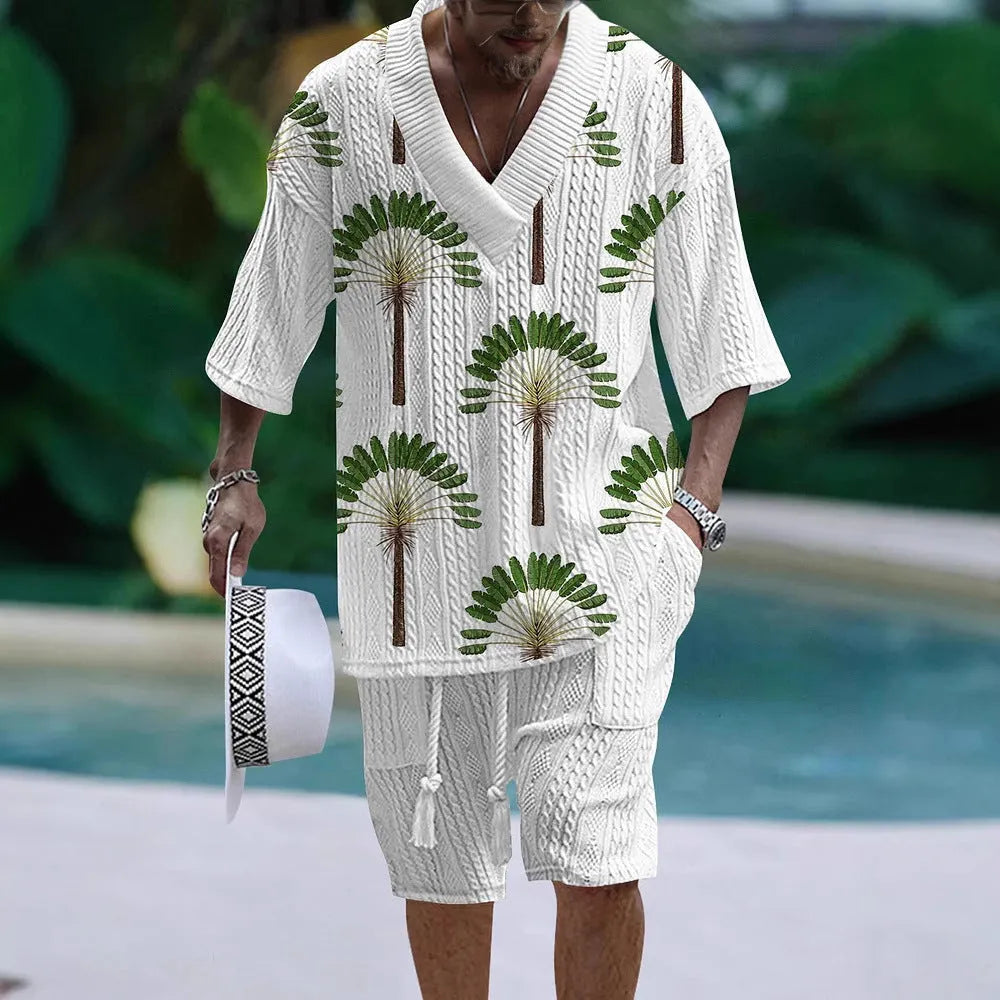 Man wearing a loose-fitting short-sleeve top and matching casual shorts in a solid colour.