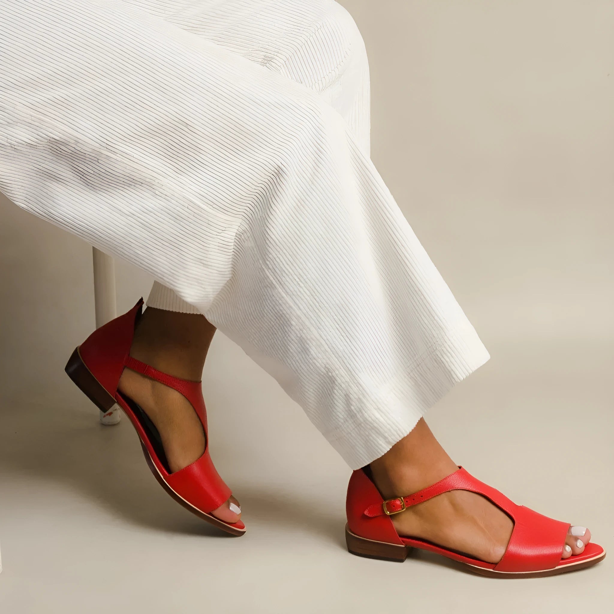 Red women's sandals with square buckle and herringbone toe pattern on artificial PU upper