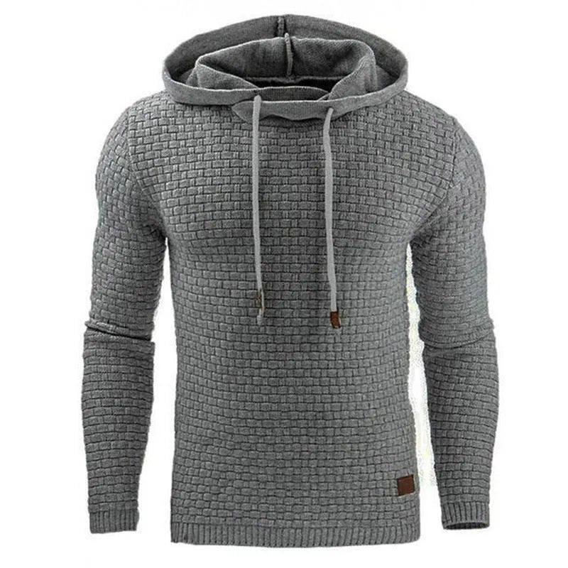 Men's black hooded sweatshirt made from cotton and polyester blend fabric on a grey background.