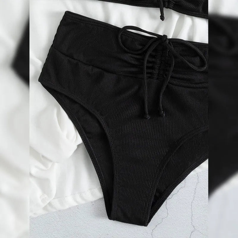Black women's bikini swimsuit with sling split high waist design and matching shorts