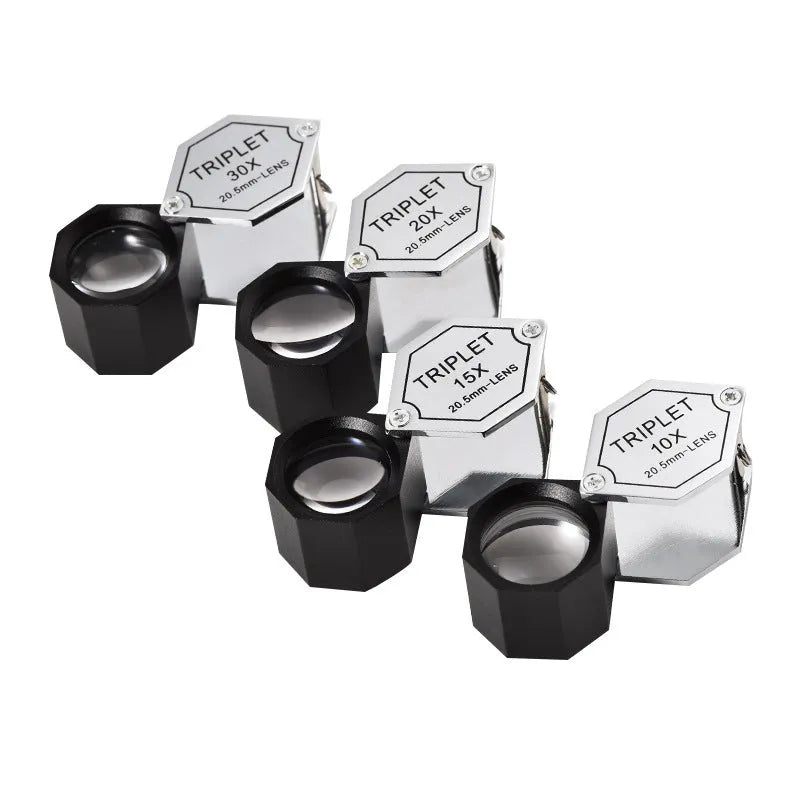 Handheld metal jeweller's loupe with optical glass lens for stamp and coin identification.