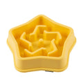 Yellow plastic dog slow feeding bowl with textured bottom for choking prevention