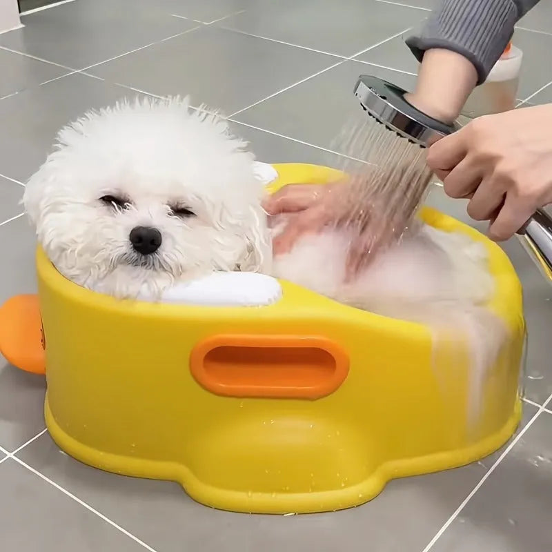 Blue PVC duck-shaped pet bathtub for washing dogs and cats on a plain background