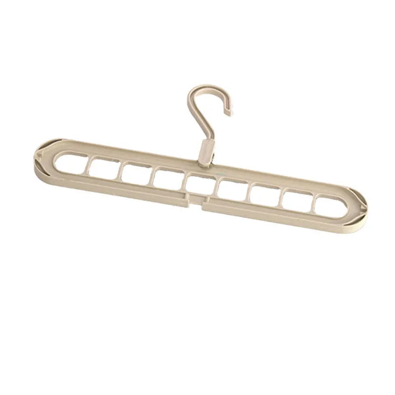 Modern plastic nine-hole folding hanger for trousers in green, blue, pink, beige, or grey.