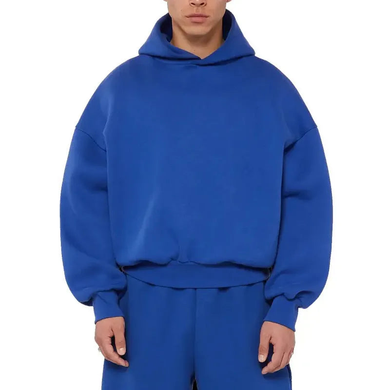 Man wearing a solid colour fleece-lined cotton pullover hoodie with a wool lining.