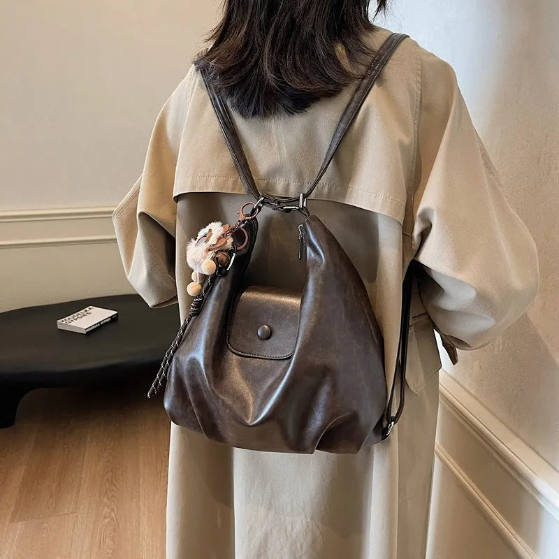 Textured PU leather commuter backpack with horizontal square design and single shoulder strap