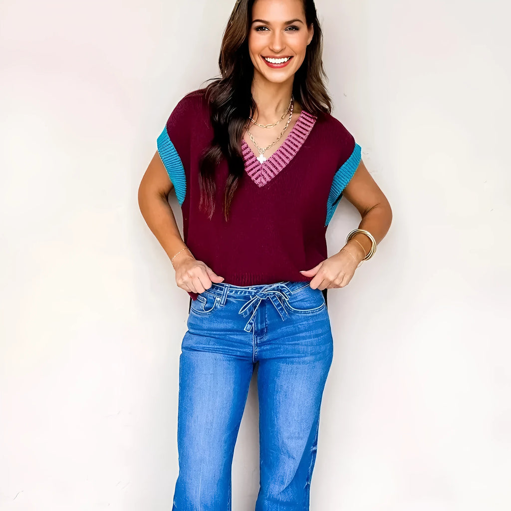 Burgundy women's V-neck sweater with white trim on collar and short sleeve cuffs