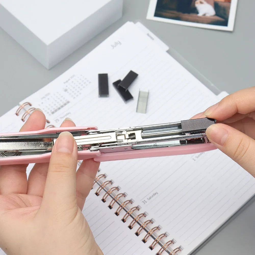Box of 1000 metal office staples in rose gold, black, purple, and rose red colours