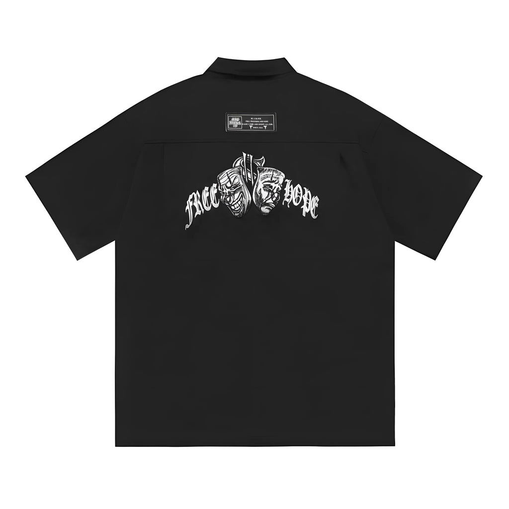 Men's black loose-fit cotton blend shirt with chest pocket and embroidered design on half sleeve.