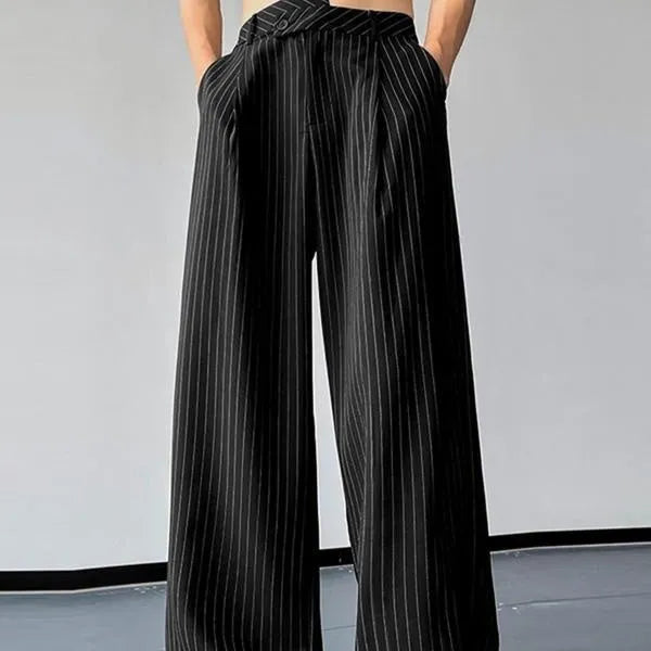 Men's black vertical striped pleated casual trousers showing elastic waistband and leg detail