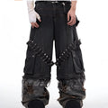 Men's grey cotton jeans with camouflage print, splicing panels, and decorative pin and ribbon details.
