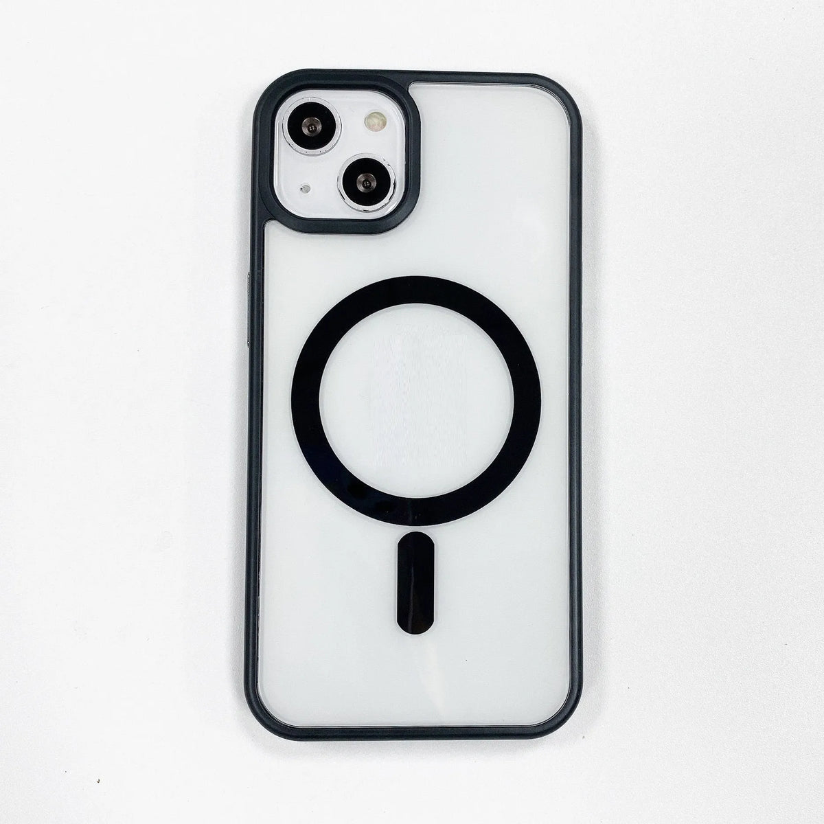 Transparent acrylic MagSafe phone case for iPhone showing magnetic ring on a pink-trimmed model.