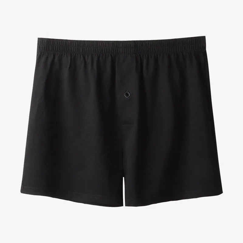 Men's loose-fit pure cotton boxer shorts in light grey, shown laid flat to display high-waist design.