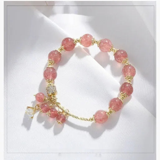 Pink women's bracelet with heart-shaped strawberry quartz crystal and pearl decorative elements