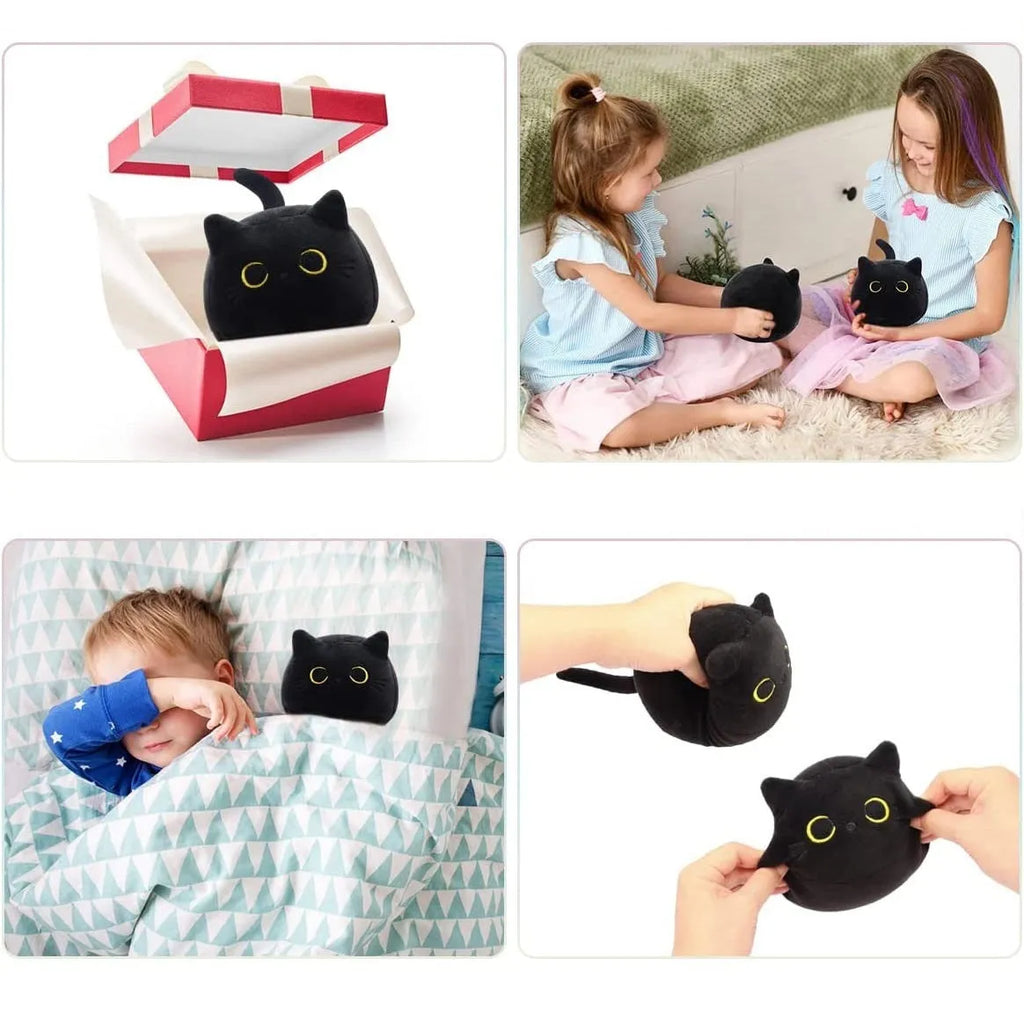 Black fluffy cat plush toy stuffed animal on a sofa, used as a soft cushion.