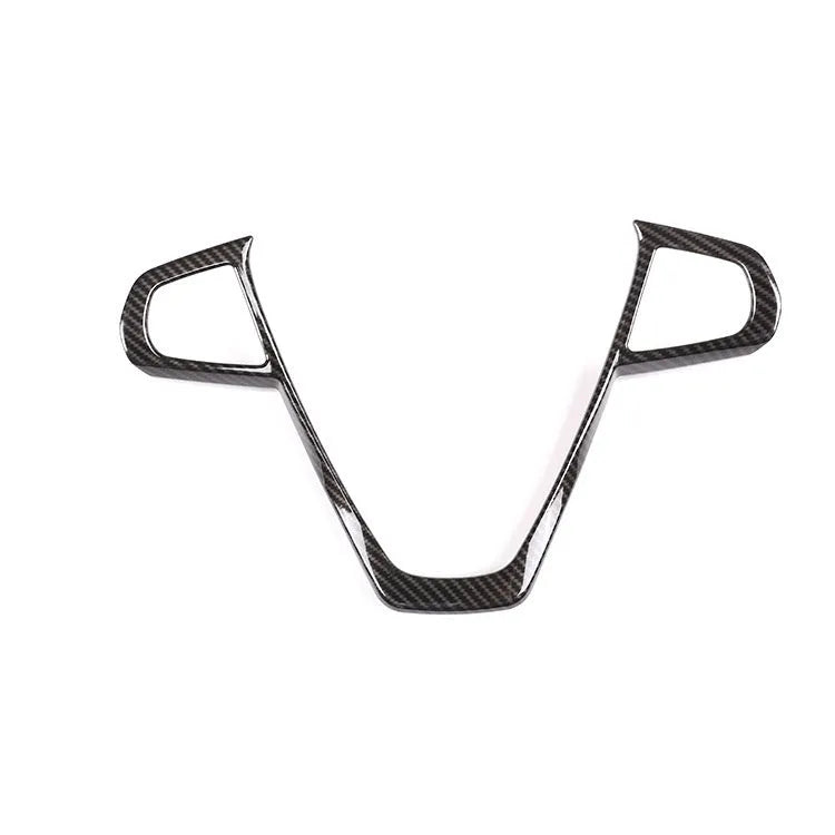 Black carbon fibre pattern button frame for BMW steering wheel, shown as a single clip-on trim piece.
