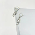 Women's retro-style fishbone pendant necklace and matching earrings set on an O-shaped chain.