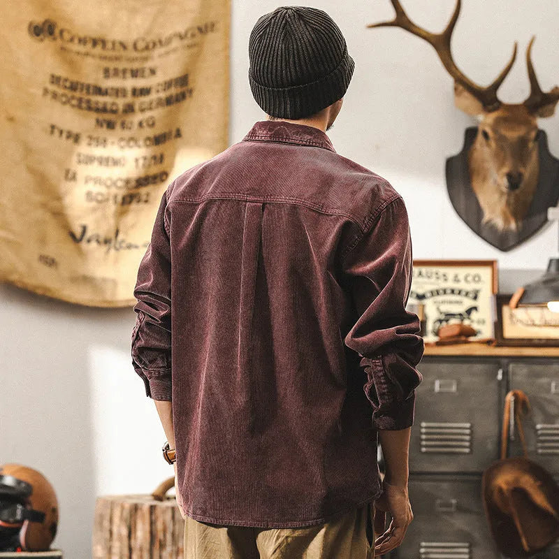 Men's black corduroy casual shirt jacket with long sleeves and a loose fit.