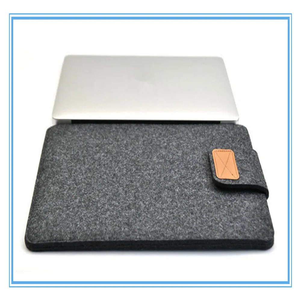 Dark grey felt plush clamshell laptop bag open to show interior with corner protectors