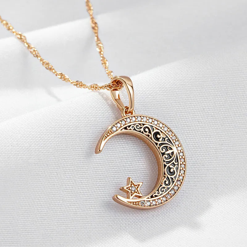 Rose gold star moon pendant necklace with zircon and enamel details on adjustable water wave chain