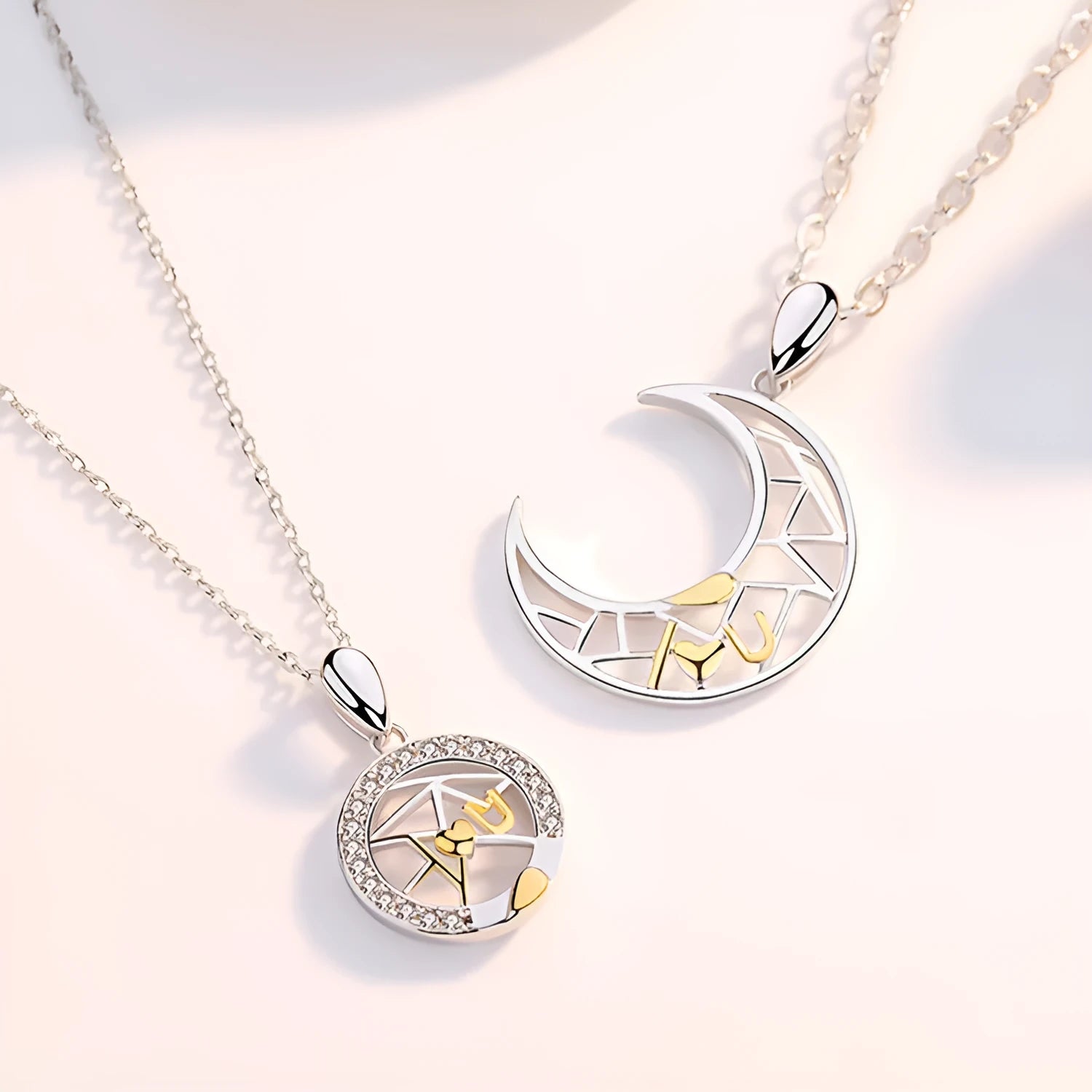 Sun Moon Tooth couple necklace set showing male and female copper pendants on cross chains