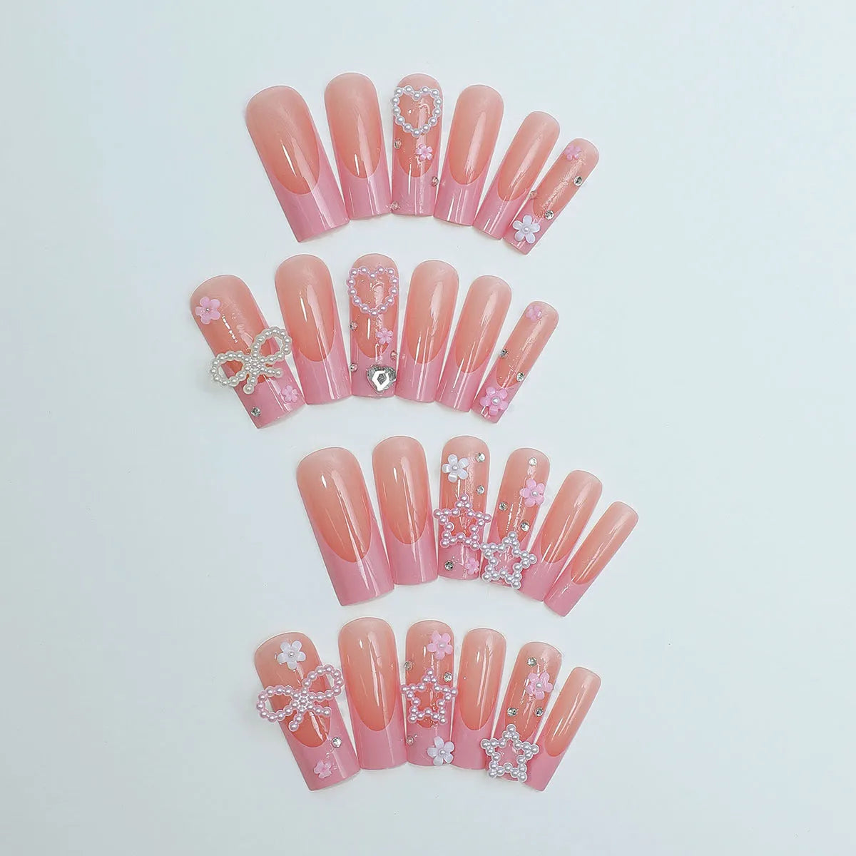 Water transfer nail art stickers with long pipe and bow design next to a plastic armour suit applicator.