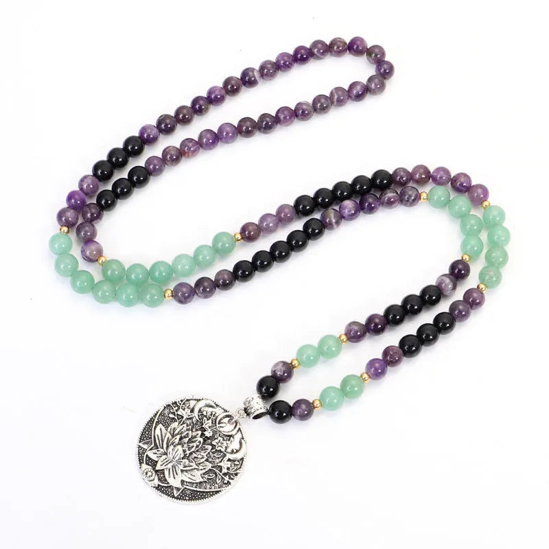 Geometric lotus pendant yoga necklace with stone bead chain and matching bracelet on white background