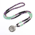 Geometric lotus pendant yoga necklace with stone bead chain and matching bracelet on white background