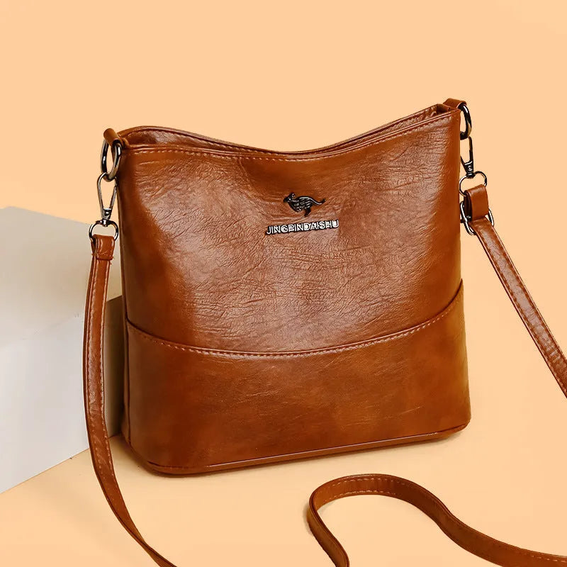 Women's soft leather shoulder bag in bucket design with large capacity and internal phone pocket